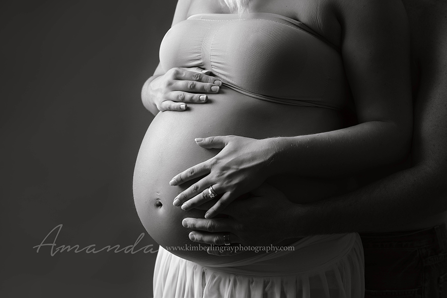 black and white studio maternity portrait